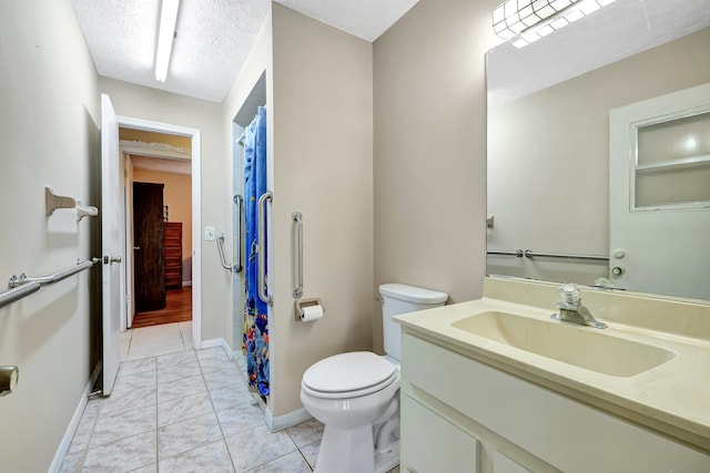 bathroom with toilet, a textured ceiling, and tile flooring