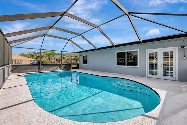 view of swimming pool with a patio and a lanai