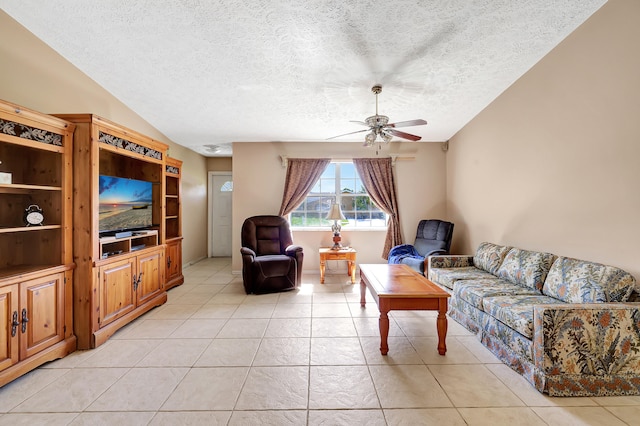 tiled living room featuring a textured ceiling and ceiling fan