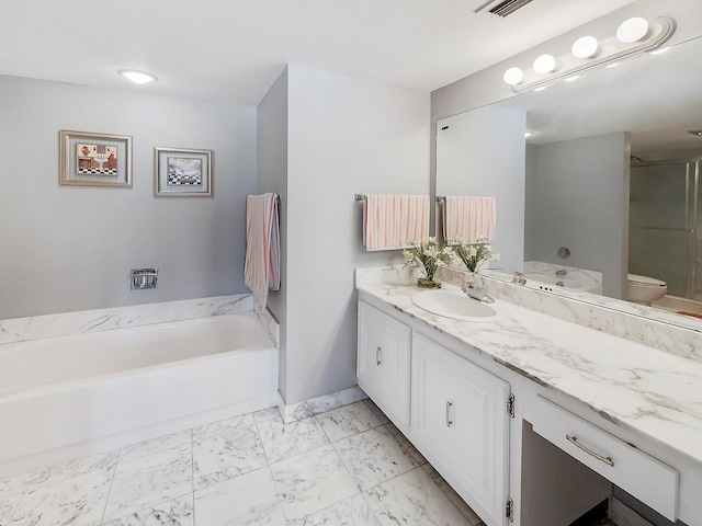 bathroom featuring a tub, tile floors, oversized vanity, and toilet