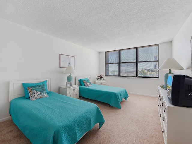 carpeted bedroom with a textured ceiling