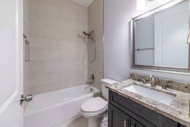 full bathroom featuring tile patterned floors, toilet, vanity, and tiled shower / bath