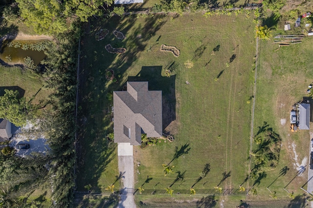 drone / aerial view featuring a water view and a rural view