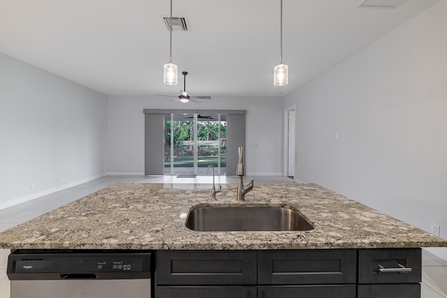 kitchen with a kitchen island with sink, dishwasher, ceiling fan, and sink