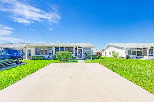 single story home with a front yard