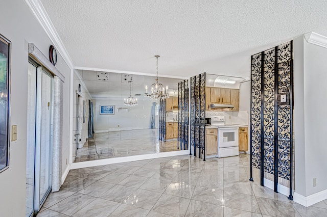 entrance foyer with a chandelier, light tile flooring, ornamental molding, and a textured ceiling