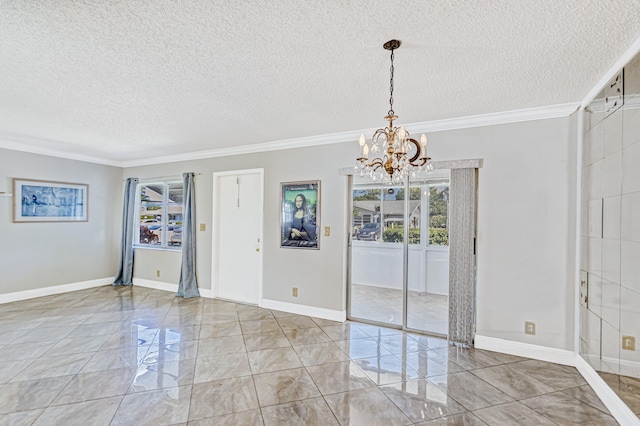 spare room with an inviting chandelier, ornamental molding, a textured ceiling, and light tile floors