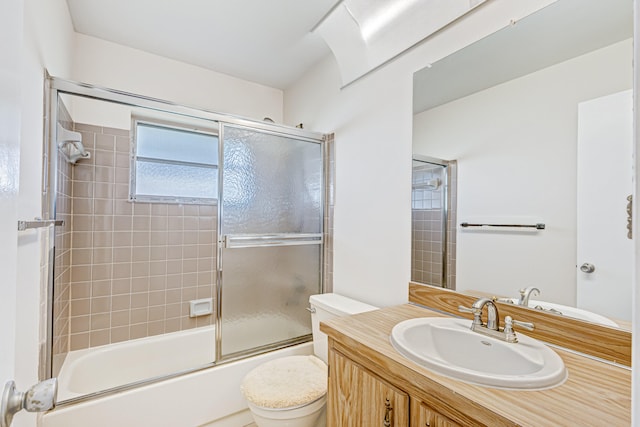 full bathroom with enclosed tub / shower combo, toilet, and oversized vanity