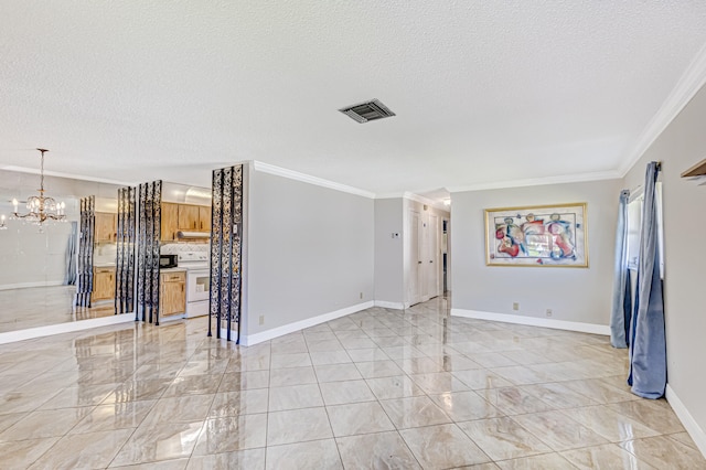 tiled spare room with an inviting chandelier, ornamental molding, and a textured ceiling