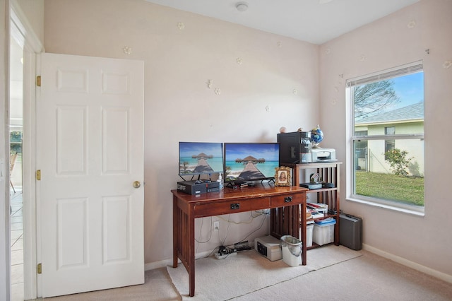 office area with light colored carpet and a healthy amount of sunlight