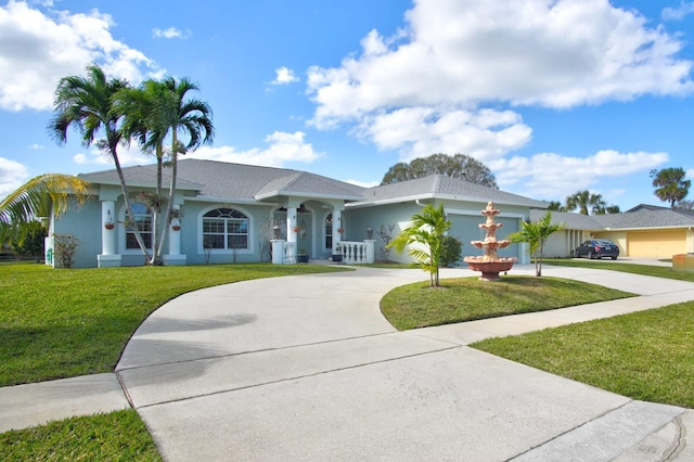 single story home with a front lawn and a garage