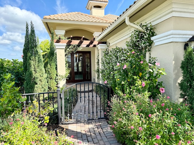 entrance to property featuring french doors