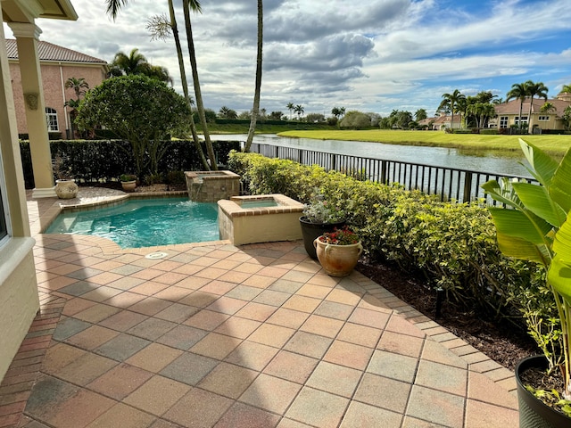 view of pool featuring a patio and an in ground hot tub