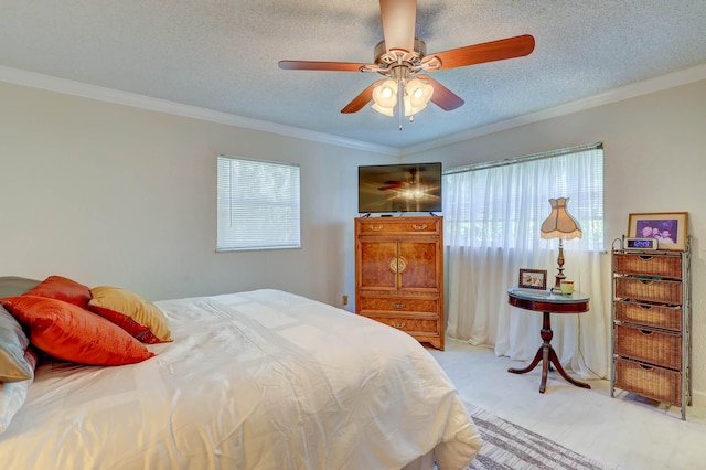 bedroom featuring ceiling fan, ornamental molding, and a textured ceiling