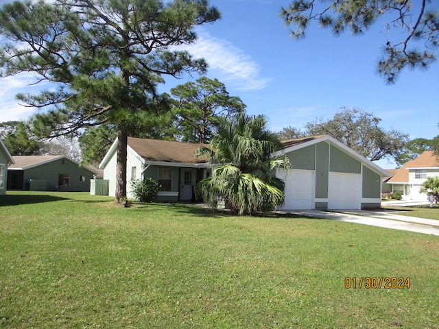 ranch-style house featuring a front yard and a garage