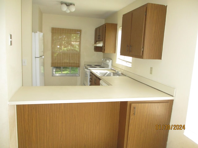 kitchen with white appliances and sink