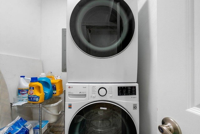 laundry area featuring stacked washer / dryer