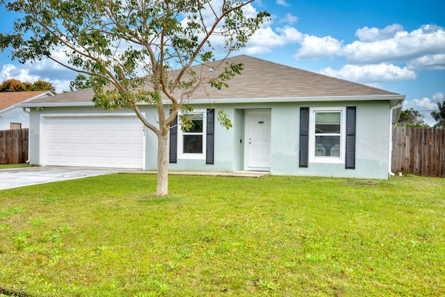 ranch-style home with a front yard and a garage