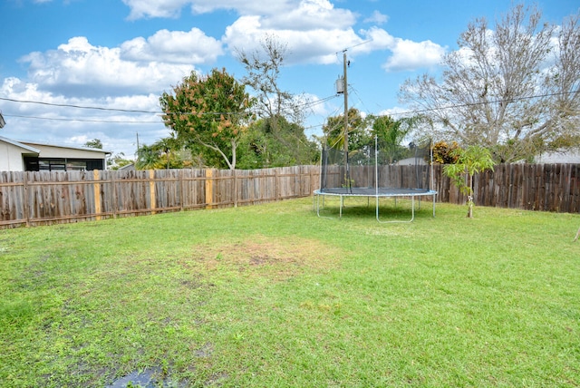 view of yard featuring a trampoline