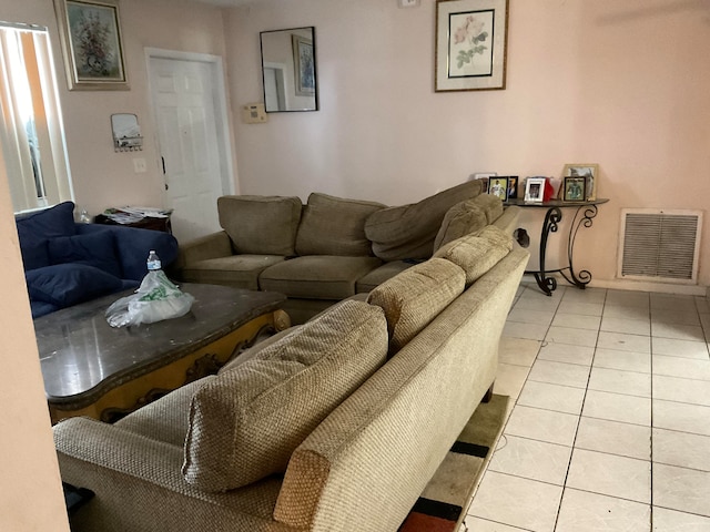 living room featuring light tile floors