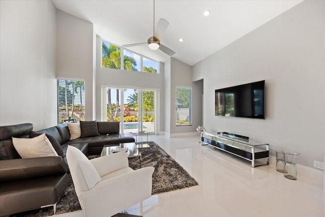 tiled living room with high vaulted ceiling and ceiling fan