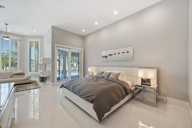 bedroom with access to exterior and light tile floors