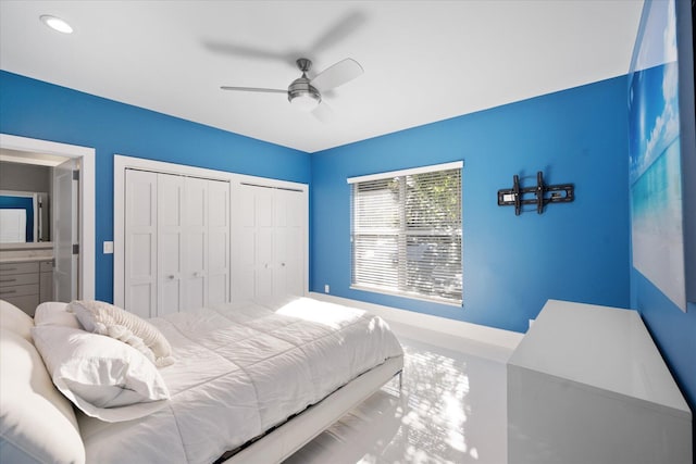 bedroom featuring multiple closets and ceiling fan