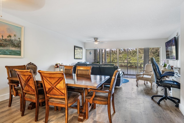 dining area featuring light hardwood / wood-style floors and ceiling fan