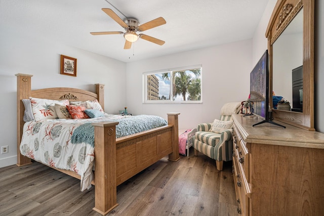 bedroom with wood-type flooring and ceiling fan