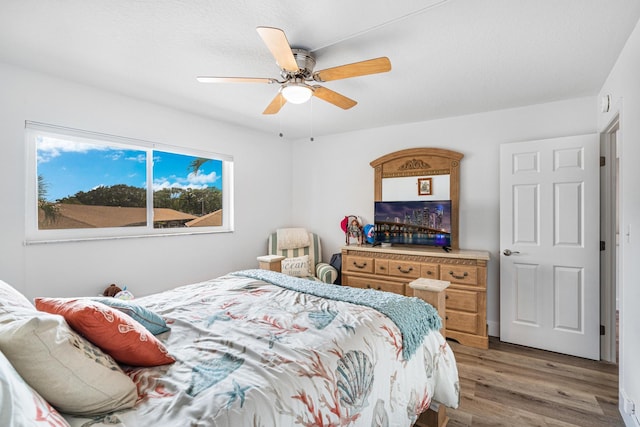 bedroom featuring wood-type flooring and ceiling fan