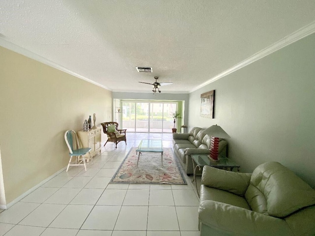 tiled living room featuring ceiling fan, crown molding, and a textured ceiling