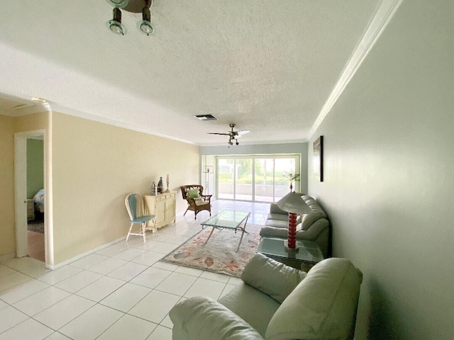 living room featuring a textured ceiling, ceiling fan, crown molding, and light tile patterned flooring