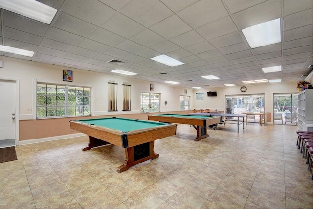 game room featuring a paneled ceiling, light tile patterned flooring, and billiards