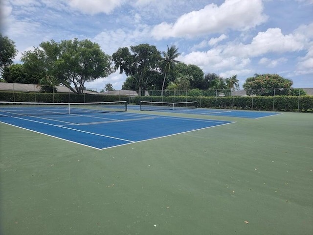 view of sport court featuring basketball hoop