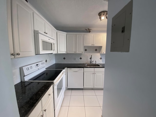 kitchen featuring electric panel, white cabinetry, and white appliances