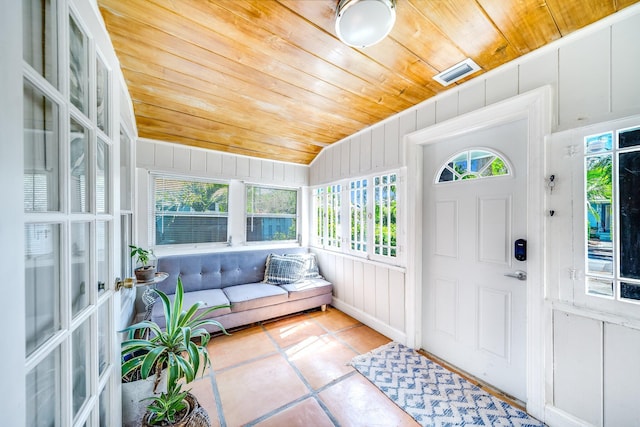 sunroom / solarium with vaulted ceiling and wood ceiling