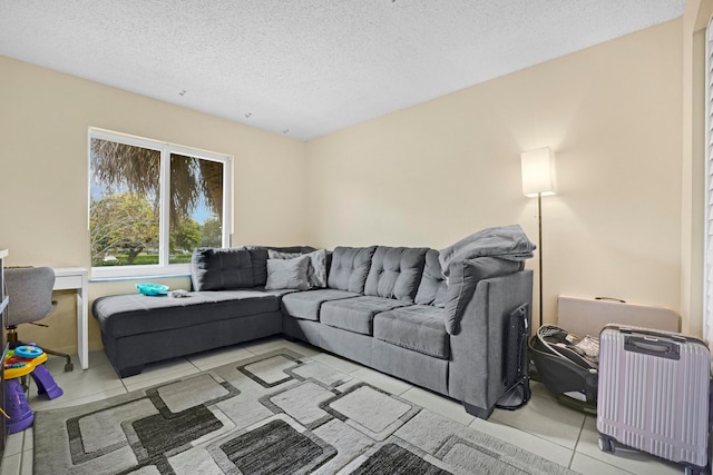 living room with radiator, a textured ceiling, and light tile patterned floors