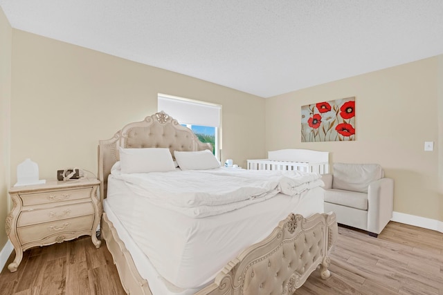 bedroom with light wood-type flooring