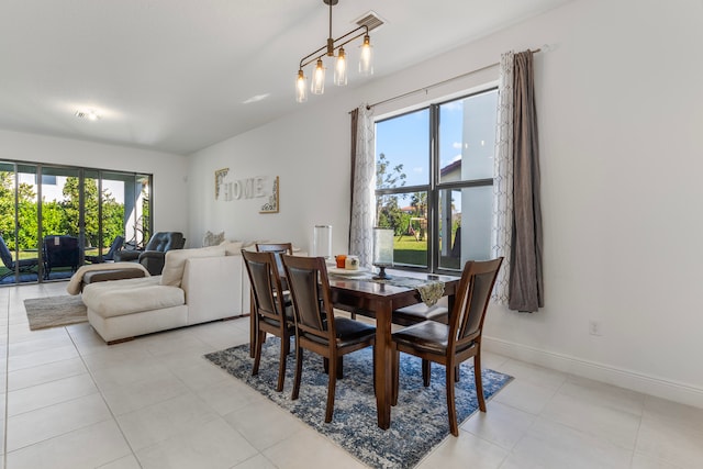 dining space with light tile floors