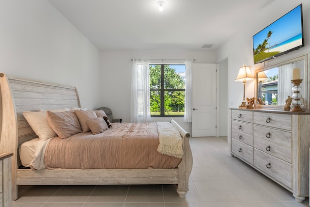 bedroom with light tile floors