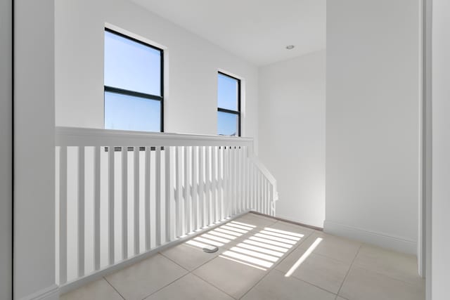 unfurnished room featuring light tile floors