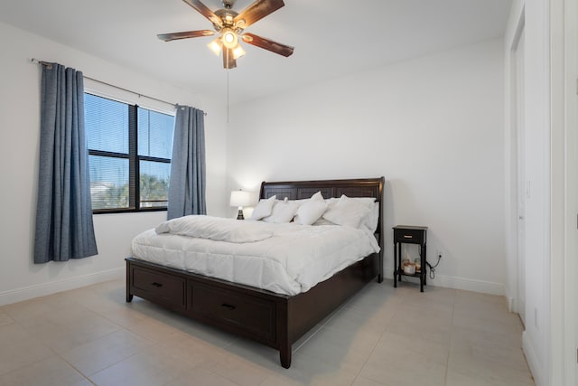 bedroom with light tile floors and ceiling fan