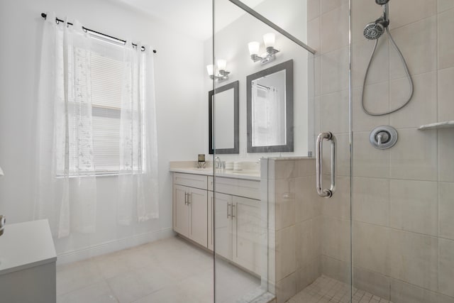 bathroom with a shower with door, tile floors, and vanity