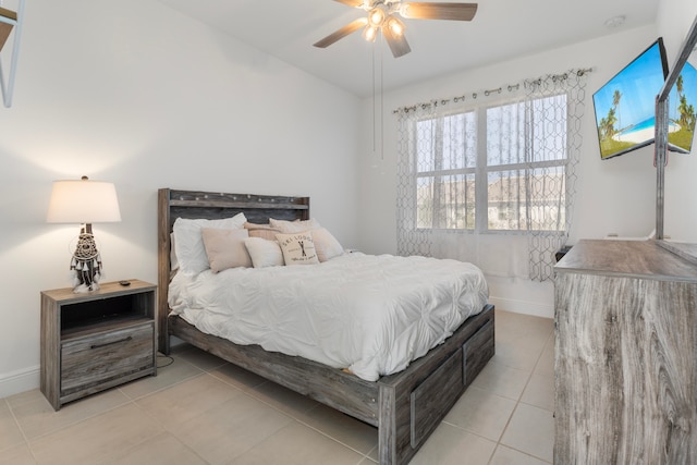 tiled bedroom with ceiling fan