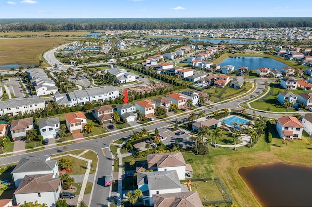 birds eye view of property featuring a water view