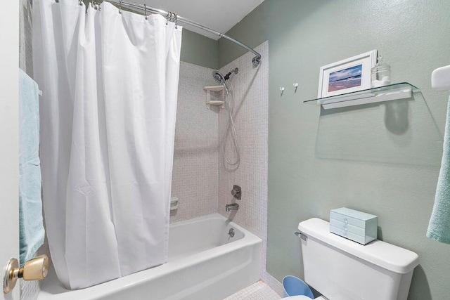 bathroom with shower / bath combo and toilet