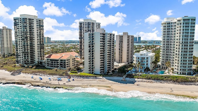 exterior space featuring a water view and a view of the beach