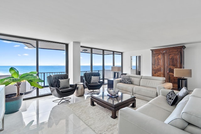 living room featuring light tile patterned floors, floor to ceiling windows, and a water view