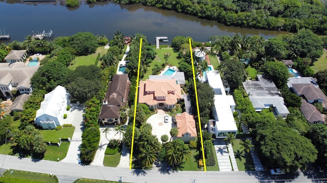 birds eye view of property featuring a water view