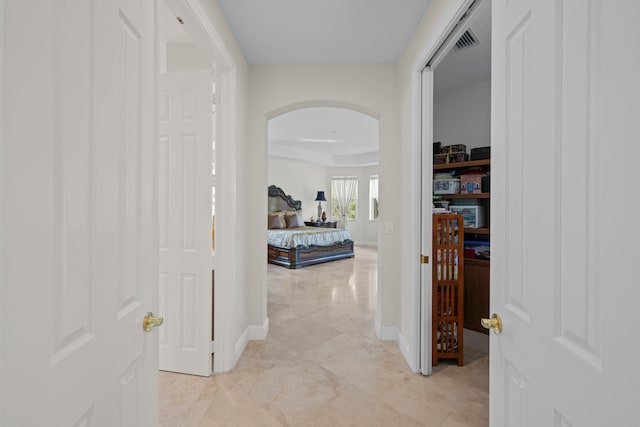 hall with light tile flooring